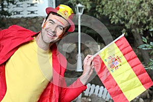 Enthusiastic Spanish man waving the national flag