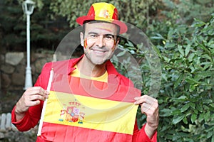 Enthusiastic Spanish man waving the national flag