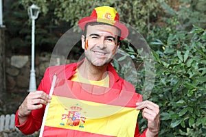 Enthusiastic Spanish man waving the national flag