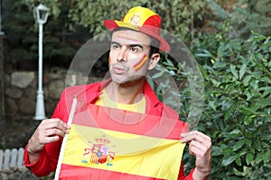 Enthusiastic Spanish man waving the national flag