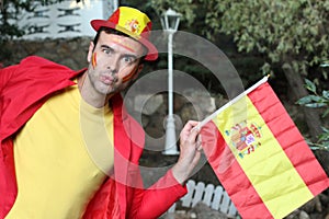 Enthusiastic Spanish man waving the national flag