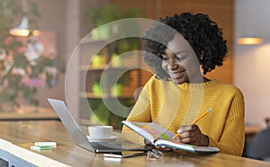 Enthusiastic student girl looking for job online, using laptop