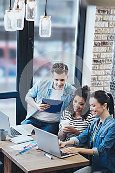 Enthusiastic three colleagues creating business plan