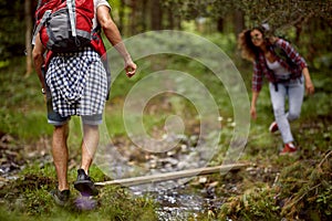 Enthusiastic traveler couple hiking together