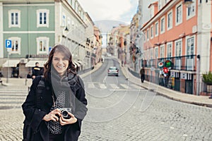 Enthusiastic traveler woman walking streets of european capital.Tourist in Lisbon,Portugal