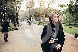 Enthusiastic traveler woman walking streets of european capital.Tourist in Lisbon,Portugal