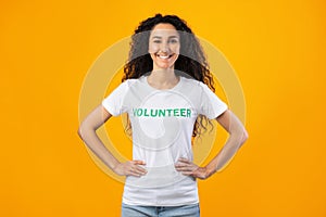 Enthusiastic Volunteer Woman Posing Smiling Standing Over Yellow Studio Background