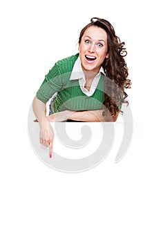 Enthusiastic woman pointing at copyspace photo