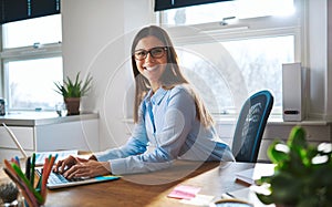 Enthusiastic woman working at desk