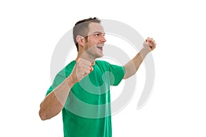 Enthusiastic young man in green isolated on white. photo