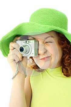 Enthusiastic young woman with a camera photo