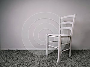 Entirely gray room with empty chair and copy space photo