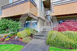 Entrance of an apartment building with concrete steps