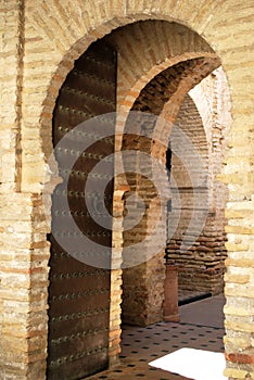 Entrance arches to the mosque mezquita within the castle, Jerez de la Frontera, Spain.