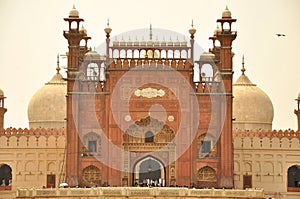 Entrance of Badshahi Mosque at dusk, Lahore, Pakistan photo