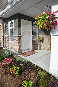 Entrance of brand new townhome decorated with flowers.