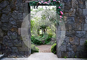 An entrance in Camellia Hill surrounded by stones and flowers originated from the Jeju Island.