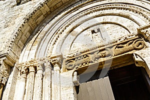 Entrance of the Collegiata di San Quirico a San Giulietta church in San Quirico d`Orcia, Tuscany, Italy photo