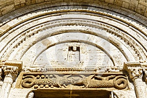 Entrance of the Collegiata di San Quirico a San Giulietta church in San Quirico d`Orcia, Tuscany, Italy photo