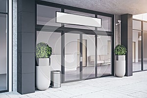 Entrance of contemporary office building with plants