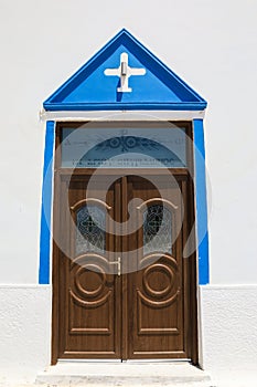 Entrance door of Agios Spyridon church in Elafonisos village island, Laconia, Peloponnese, Greece June 2018.