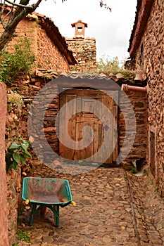 Entrance Door Antiquisime To A House The 19th Century In A Picturesque Village With Black Slate Roofs In Madriguera. Animals Holid photo