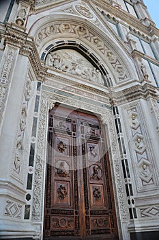 The entrance door of Basilica of Santa Croce Florence Italy.