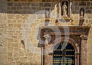 Entrance door of the facade of the baroque church of Santo Domingo in Mula, Region of Murcia, Spain