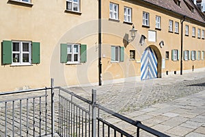 Entrance door on facade of Fuggerei in Augsburg