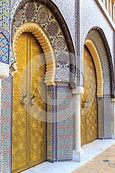 Entrance door with mosiac and brass door at the Royal palace in