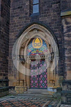 Entrance door of the neo gothic Cathedral of Saints Peter and Paul in the Visegrad Fortress, Prague.