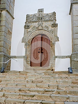 Entrance door with stone stairs in Manueline style in Portugal