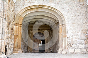 Entrance door to Crato Castle in Flor da Rosa in Portugal photo