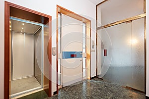 Entrance with elevator and glass door in country house