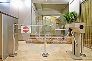 Entrance equipped with turnstile photo