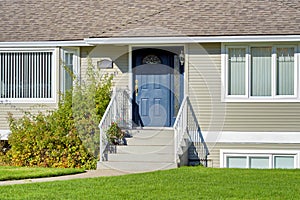 Entrance of family house on bright sunny day in Vancouver, BC