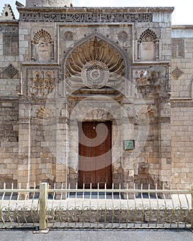 Entrance of Fatimid era Aqmar Mosque, with lavish decoration across the entire facade, Muizz Street, Cairo, Egypt