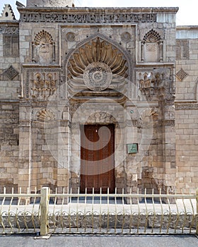 Entrance of Fatimid era Aqmar Mosque, with lavish decoration across the entire facade, Muizz Street, Cairo, Egypt photo