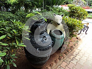 The entrance of garden in India, bear as a wastebin holder