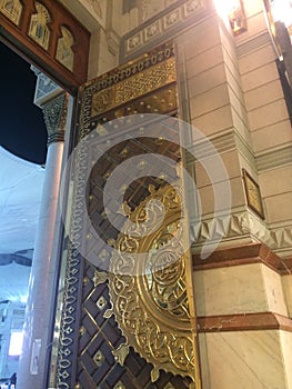 Entrance gate of Al-Masjid an-Nabawi - Artistic arabic design in gold - Prophet\'s Mosque - Islamic pilgrim site
