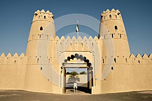 Entrance gates to the famous Al Jahili Fort in UAE under a blue sky on a sunny day