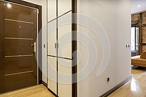 Entrance hall of a house with access to several rooms with built-in wardrobes, custom-made wooden bookcases and access to a living