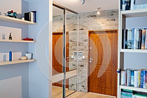 Entrance hall in modern apartment with mirror wardrobe