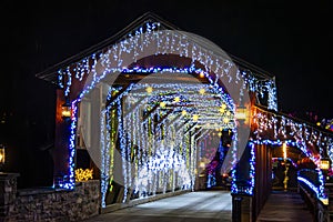 Entrance Of Herr's Mill Covered Bridge Adorned With Twinkling Blue And White Christmas Lights