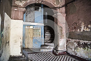 Entrance of ruinous house, remains of colonial styled house in Santiago de Cuba, Cuba