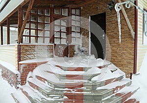 Entrance of house in a snowdrift