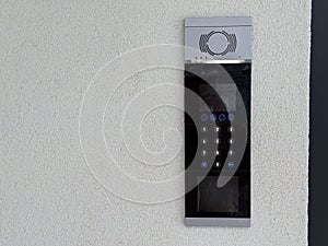 Entrance intercom with keypad. Security access, residential building control and modern communication technology. Copy space