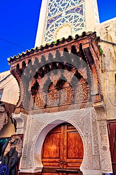 Entrance of a mosque in old style and a magnificent wooden gate