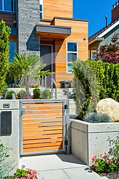 Entrance of new luxury family house with landscaped front yard
