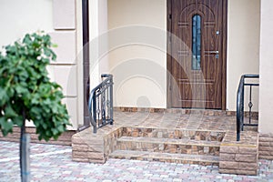 The entrance of a new modern house outside view. Decorated with